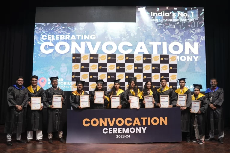 A group of SkillCircle graduates holding certificates in front of the convocation banner