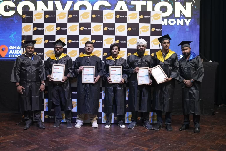 SkillCircle graduates in gowns holding their certificates